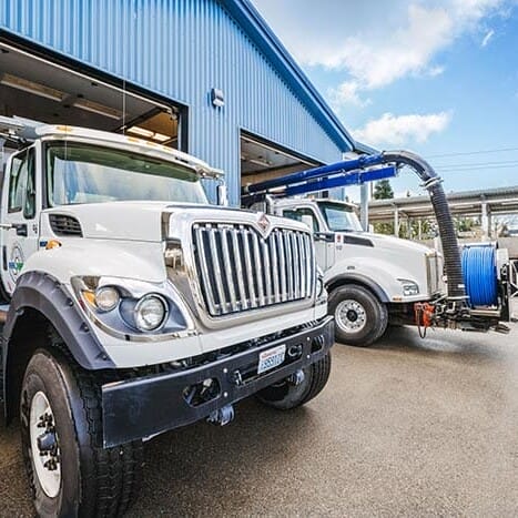 two industrial trucks in the bay of a warehouse